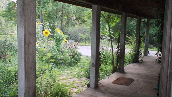 Historic Home Castle Chateau organic herb farm wood deck porch sunflowers echinacea covered deck front door